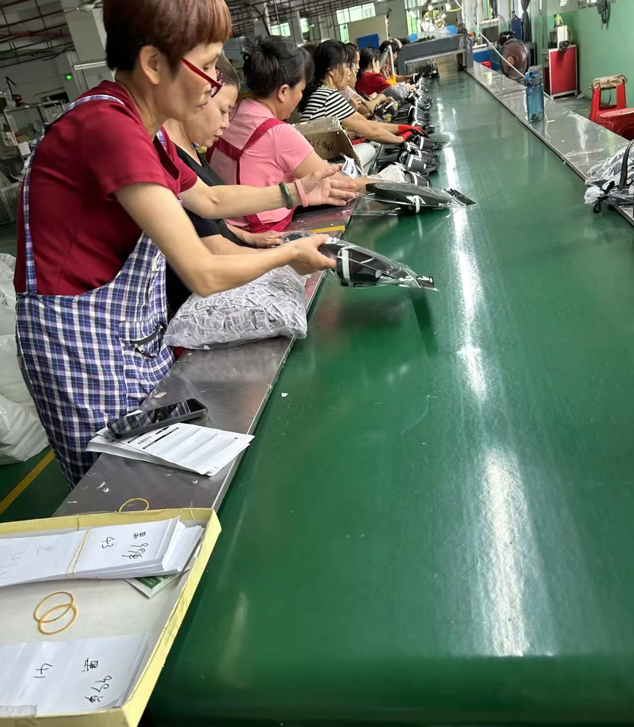 Workers placing slides into individual bags