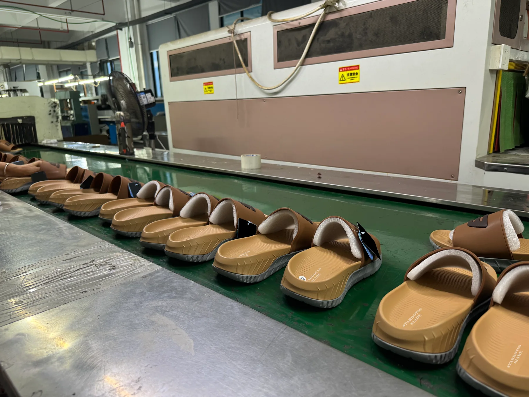 Slides arranged along the production conveyor